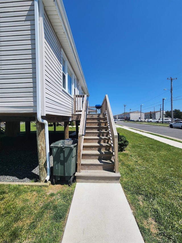 view of home's exterior with a lawn