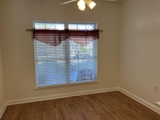 interior space featuring wood-type flooring and ceiling fan