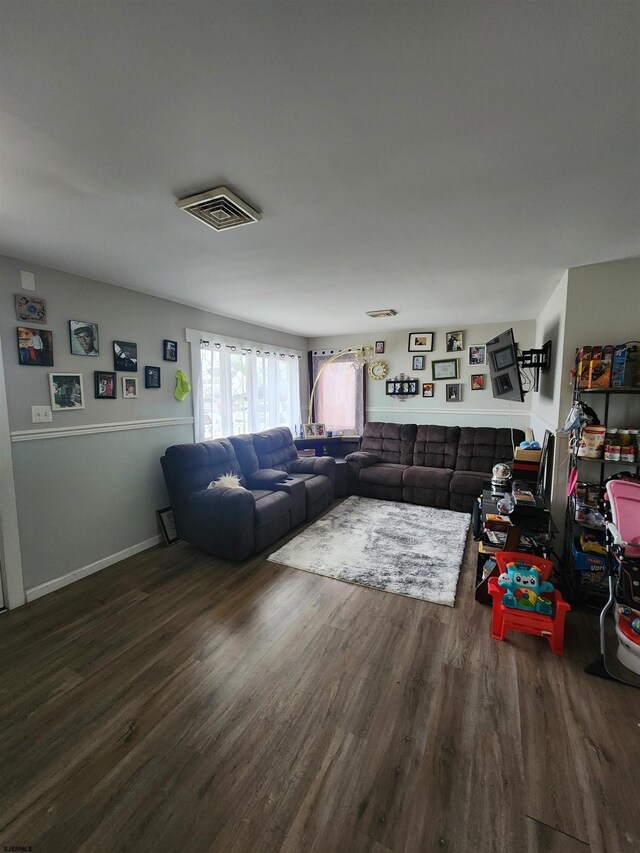 living room with dark hardwood / wood-style floors