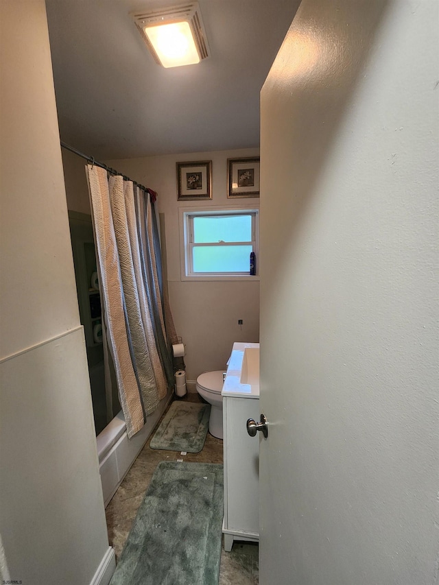 bathroom with toilet and shower / tub combo with curtain