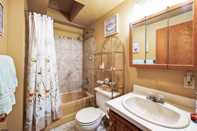 full bathroom featuring toilet, tile patterned floors, shower / tub combo with curtain, and vanity