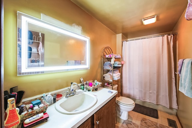 full bathroom with toilet, shower / bath combo, and vanity