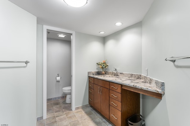 bathroom with vanity and toilet