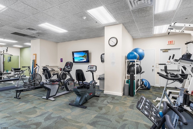 workout area featuring a paneled ceiling