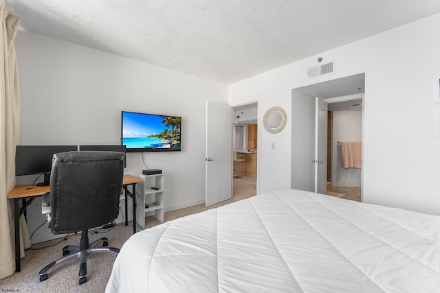 carpeted bedroom with a textured ceiling