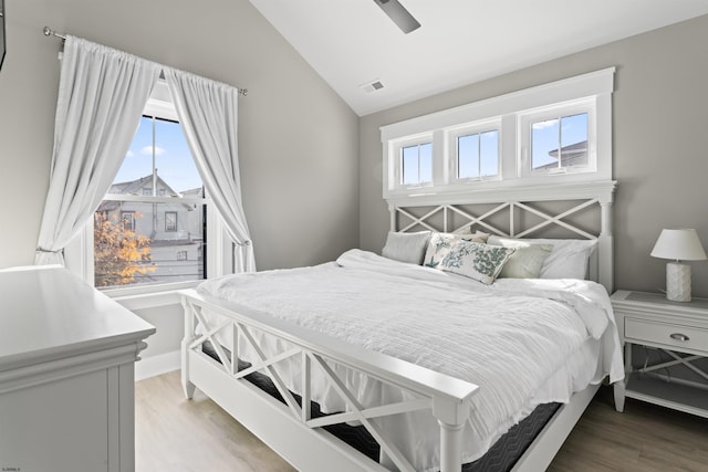 bedroom featuring vaulted ceiling, ceiling fan, and hardwood / wood-style flooring