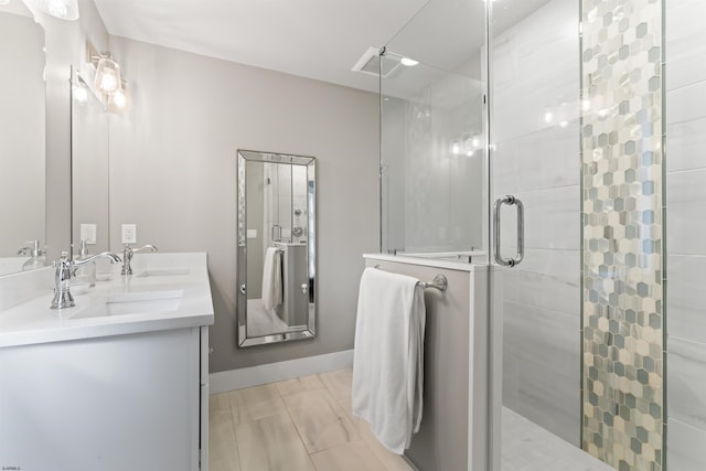 bathroom featuring vanity and a shower with shower door