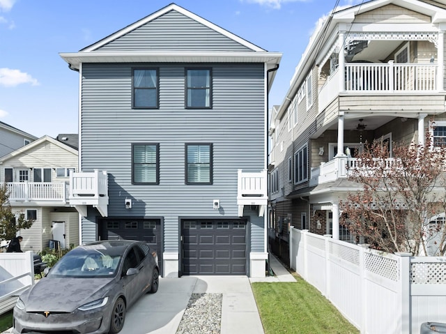 view of front of property featuring a balcony and a garage