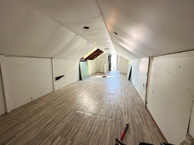 additional living space with vaulted ceiling