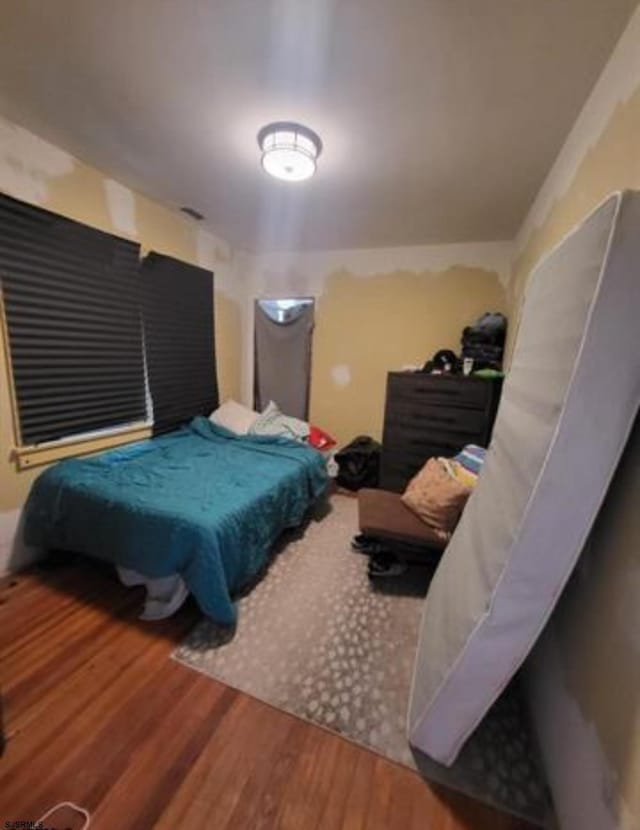 bedroom featuring hardwood / wood-style flooring