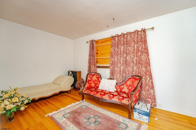 sitting room featuring hardwood / wood-style flooring