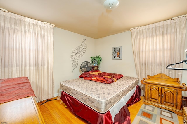 bedroom with light hardwood / wood-style flooring