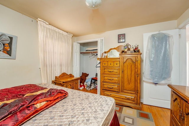 bedroom featuring a closet and light hardwood / wood-style flooring