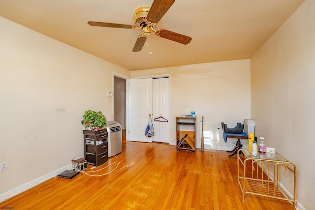 misc room featuring ceiling fan and hardwood / wood-style floors