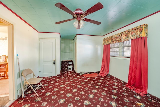 unfurnished bedroom with ceiling fan and carpet