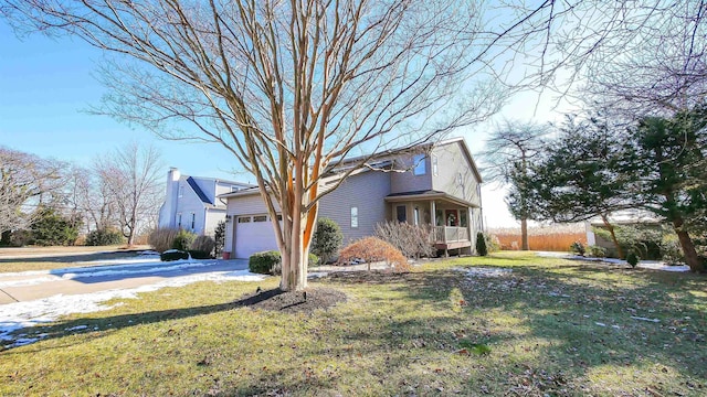 view of home's exterior with a lawn and a garage