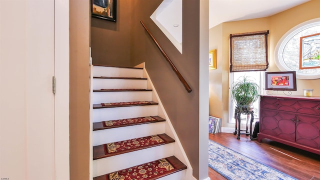 stairs with wood-type flooring