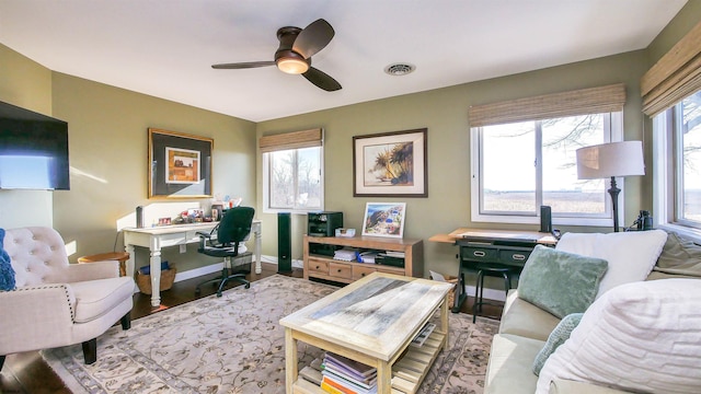 office area with ceiling fan, a healthy amount of sunlight, and light wood-type flooring