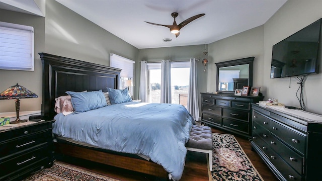 bedroom featuring ceiling fan and dark hardwood / wood-style flooring