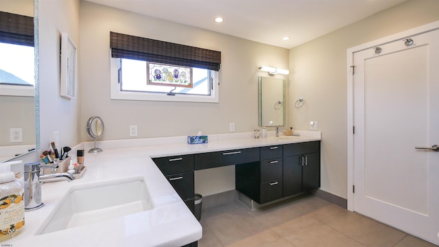 bathroom with tile patterned flooring and vanity