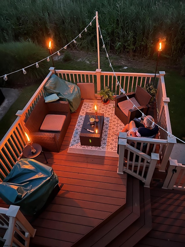 wooden terrace with outdoor lounge area