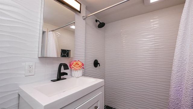 bathroom with walk in shower, backsplash, and vanity