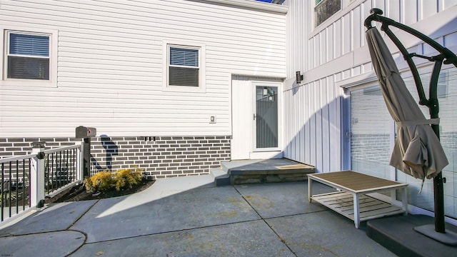 doorway to property with a patio area