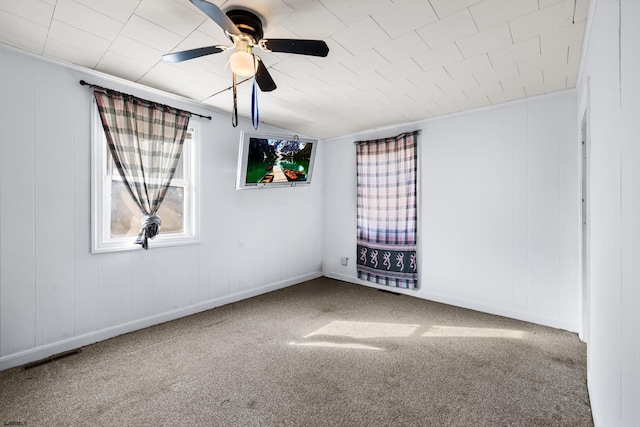 carpeted empty room with lofted ceiling and ceiling fan