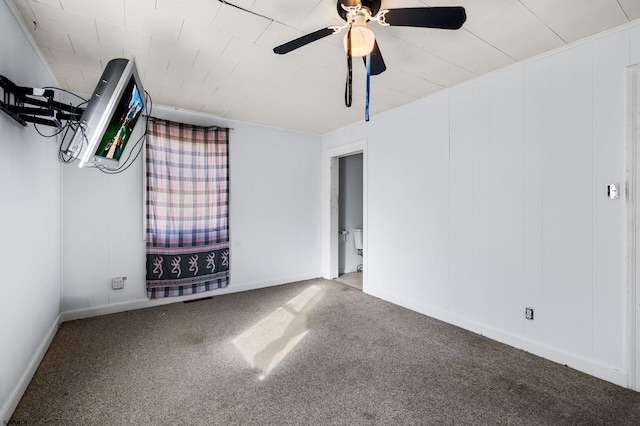 spare room featuring carpet floors and ceiling fan