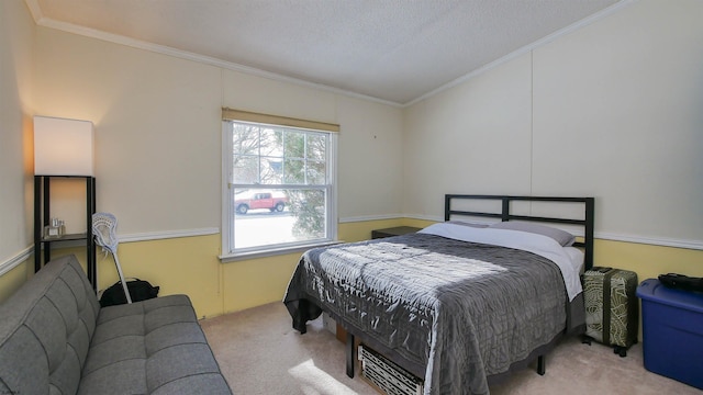 bedroom with a textured ceiling, light colored carpet, and ornamental molding