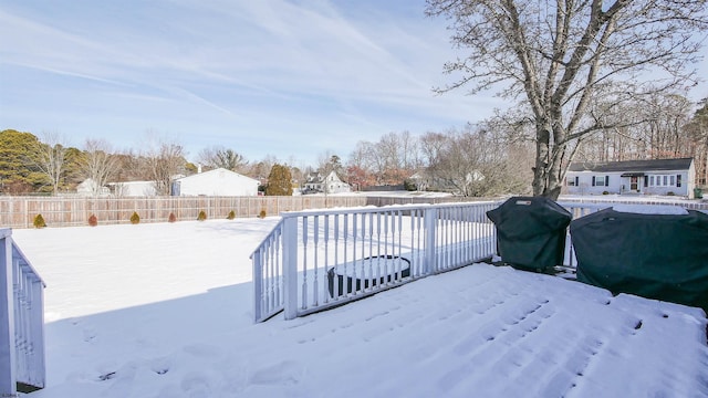 yard covered in snow with a pool