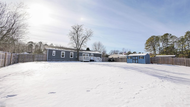 exterior space featuring a storage shed and a wooden deck