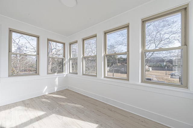 unfurnished sunroom featuring plenty of natural light