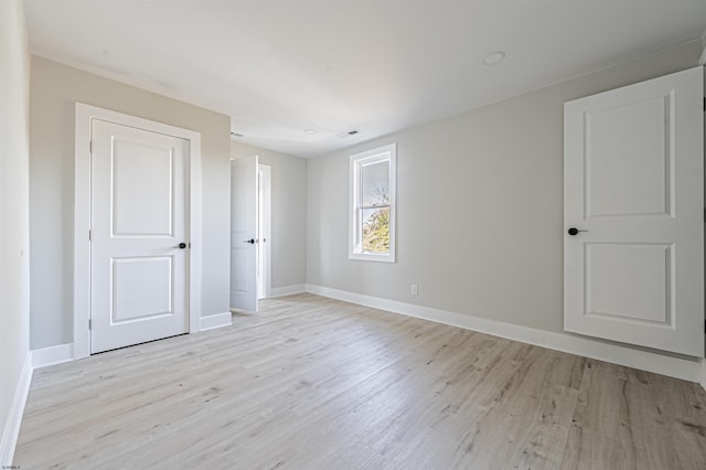 spare room with light wood-type flooring