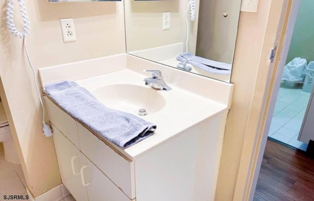 bathroom with wood-type flooring and vanity