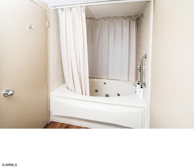 bathroom featuring shower / bathtub combination with curtain