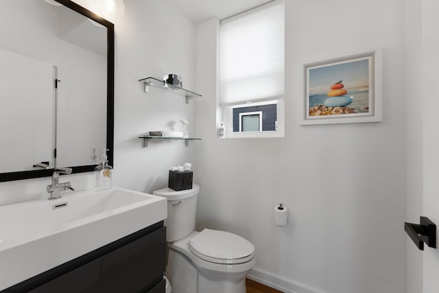 bathroom with toilet and vanity