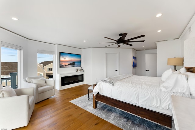 bedroom with ceiling fan and light hardwood / wood-style flooring