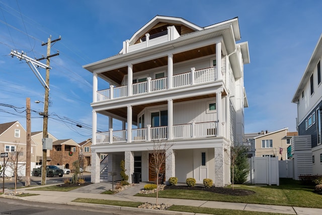 coastal home featuring a balcony