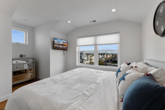 bedroom featuring dark hardwood / wood-style flooring and vaulted ceiling