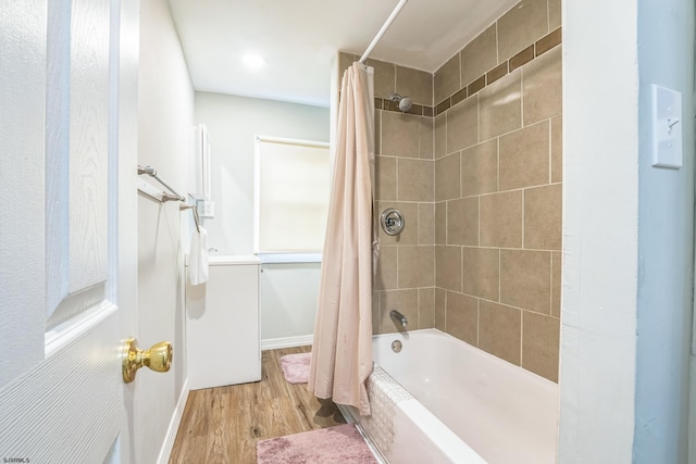 bathroom featuring shower / bathtub combination with curtain and wood-type flooring