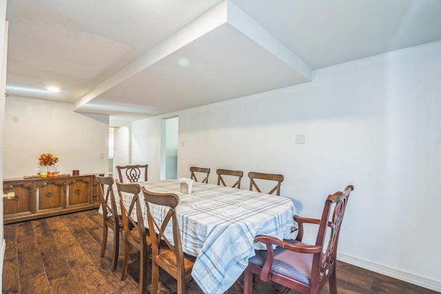 dining area featuring dark wood-type flooring