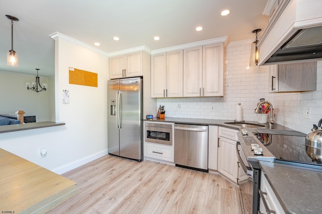 kitchen featuring custom exhaust hood, appliances with stainless steel finishes, hanging light fixtures, ornamental molding, and decorative backsplash