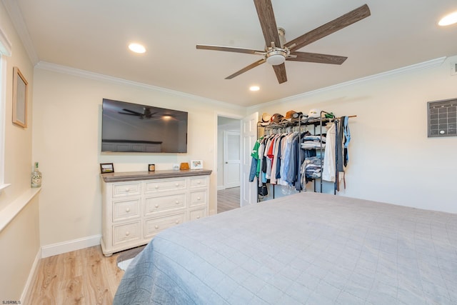 bedroom with ceiling fan, a closet, and crown molding