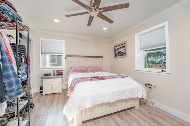 bedroom featuring ornamental molding, ceiling fan, and light hardwood / wood-style floors