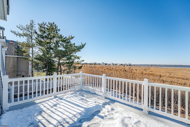 wooden deck featuring a rural view