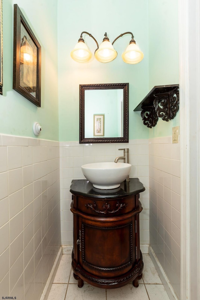 bathroom featuring tile walls, tile patterned flooring, and vanity