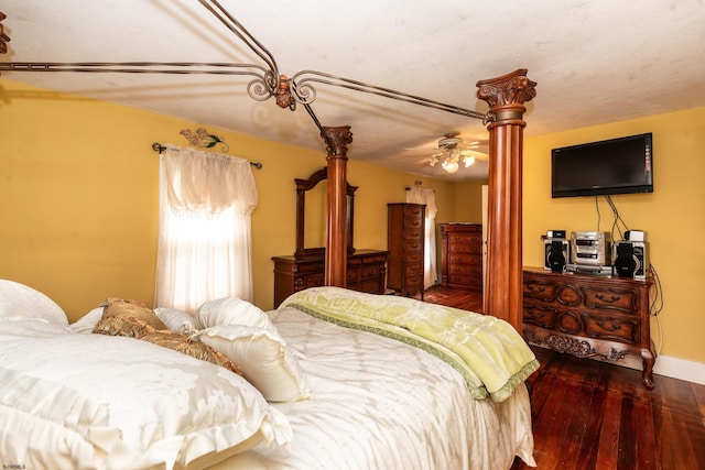 bedroom featuring ceiling fan and dark hardwood / wood-style floors