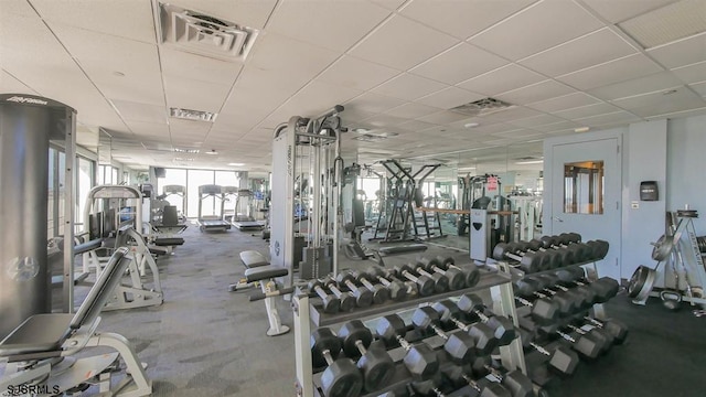 workout area featuring a paneled ceiling