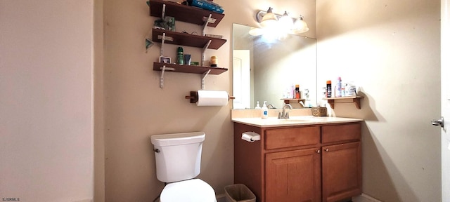 bathroom with toilet and vanity